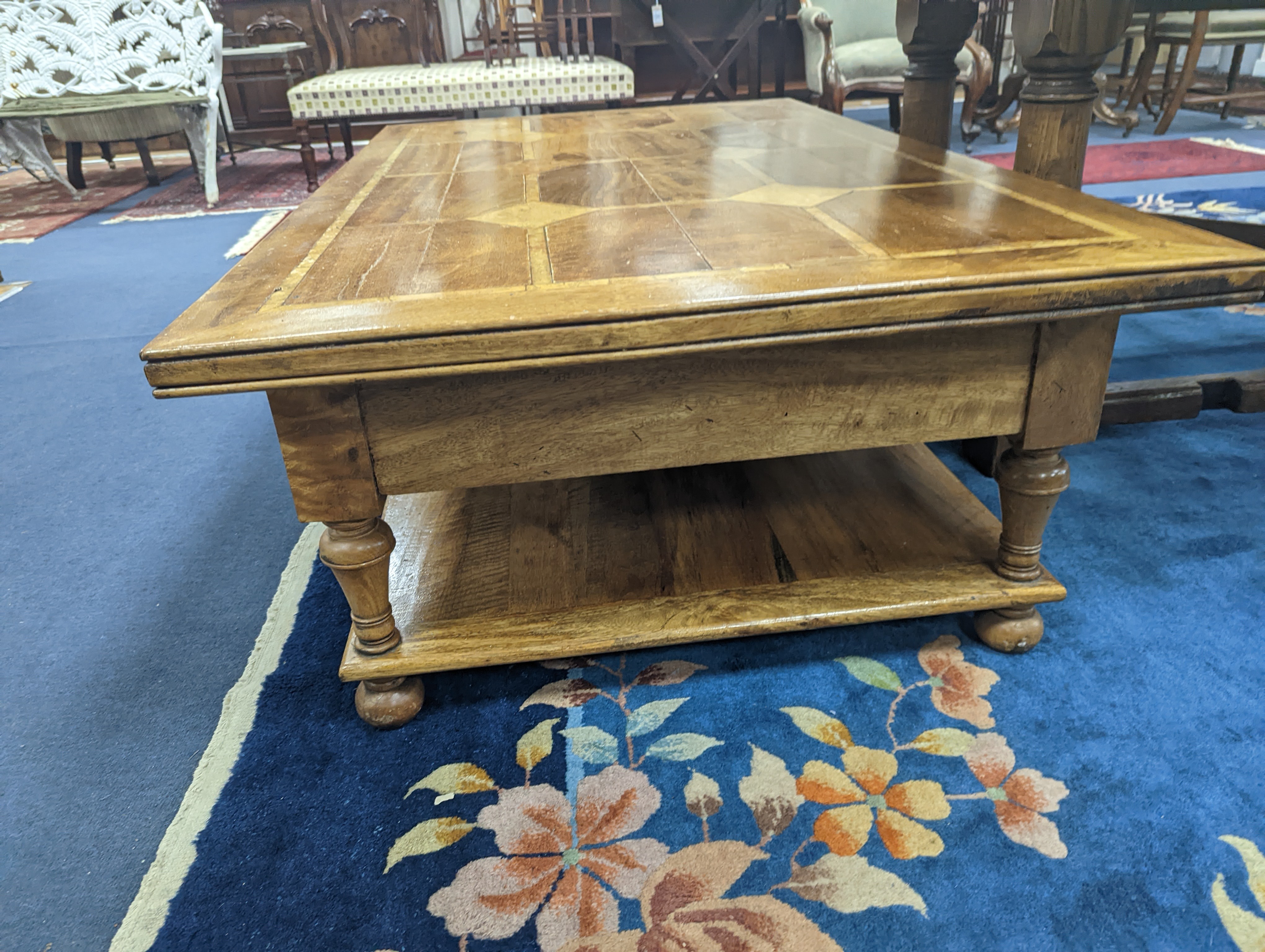 A hardwood and marble inset coffee table, length 130cm, depth 80cm, height 45cm